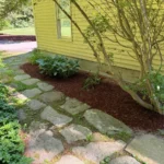 Garden bed mulching and professional edging around residential property