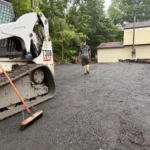 Hardscape construction excavation work preparing foundation for paver installation