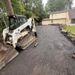 Professional paver installation in progress on residential property