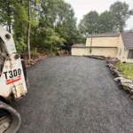 Retaining wall construction and hardscape preparation for backyard project
